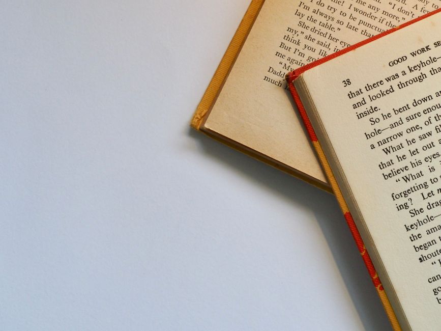 open hardcover books on a surface