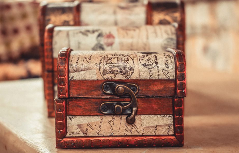 Close-up of an ornate wooden chest with vintage design elements, ideal for decoration.