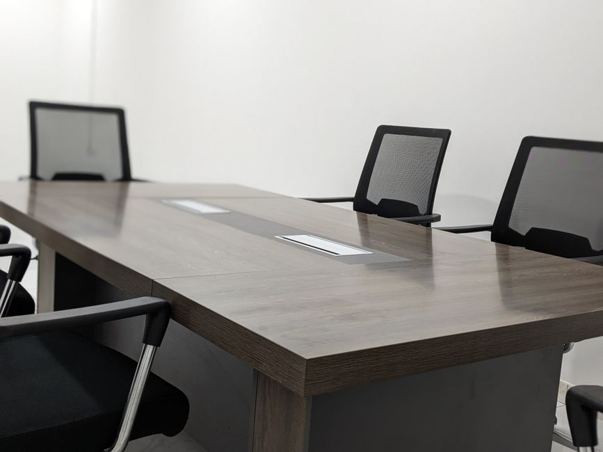 Sleek and empty conference room with modern furniture and minimalist design.