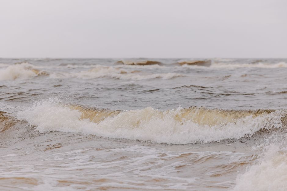 A captivating image of ocean waves crashing onto the shore, showcasing the power of nature.