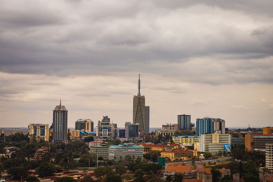 Explore the vibrant skyline of Nairobi with its modern skyscrapers under an overcast sky.