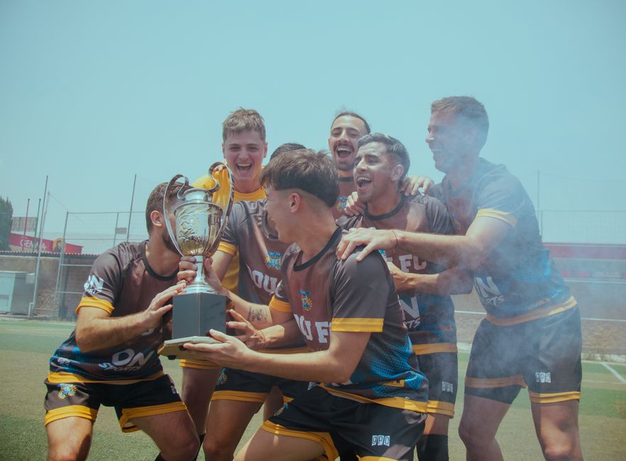 Group of athletes celebrating teamwork and success in a sports event, highlighting unity, discipline, and healthy competition