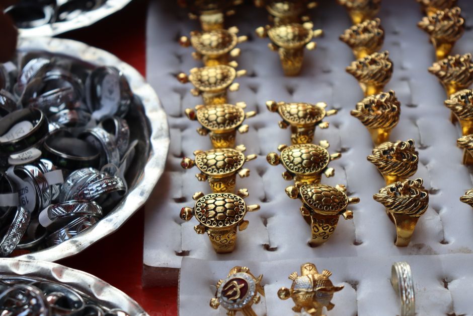 Luxury gold and silver rings displayed in an organized fashion, ideal for gifting or as souvenirs.