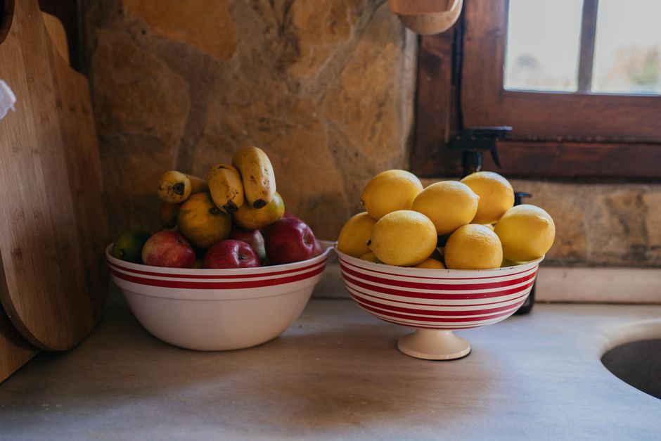 A colorful bowl of fresh fruit and boiled eggs
