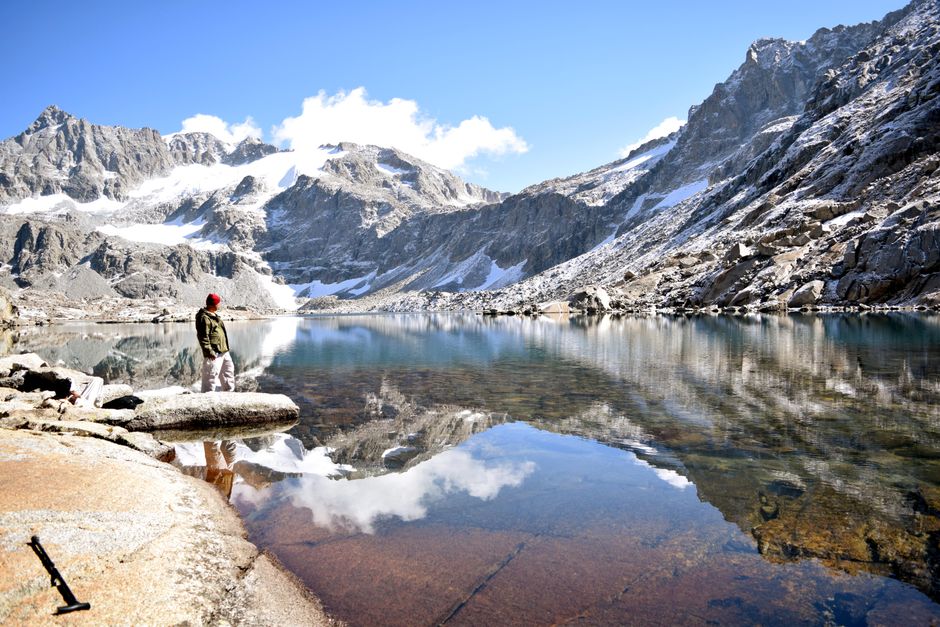 Stunning mountain lake surrounded by rugged peaks in Khyber Pakhtunkhwa, Pakistan.