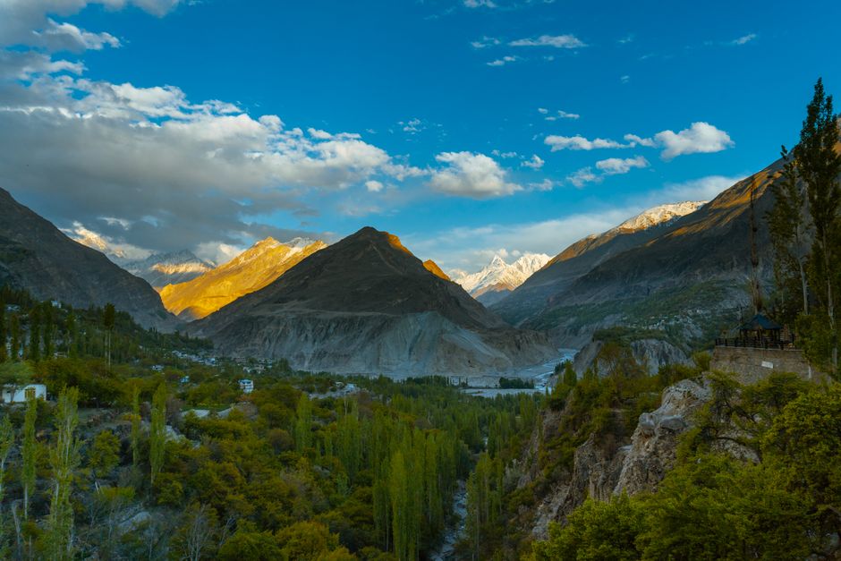 Stunning sunset over Garelt Valley with vibrant landscapes and majestic mountains.