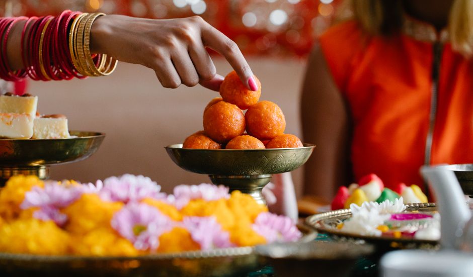 A vibrant display of Indian festive sweets and decorations showcases lively colors and cultural richness.